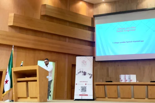 Scinox engineer explaining industrial project development to mechanical engineering students at Damascus University